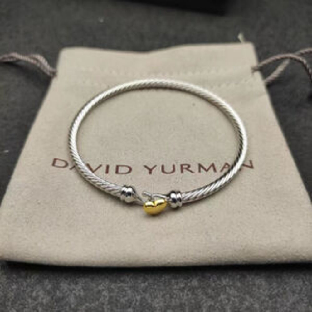 David Yurman's gold heart-shaped silver bracelet